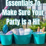 A bucket of towels and two other buckets with pool party supplies