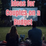 Man and woman sitting on a blanket at an outdoor movie.