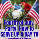 A mason jar filled with red, white, and blue flowers and two American flags.