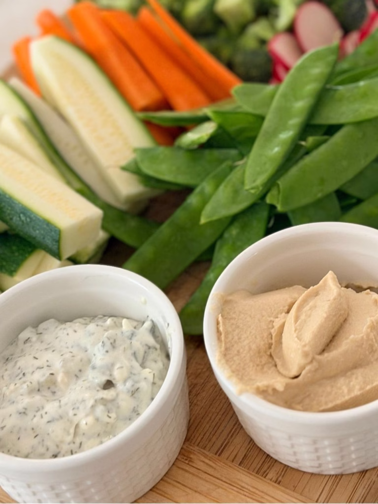 pool snacks for party with hummus and tzatziki and vegetables