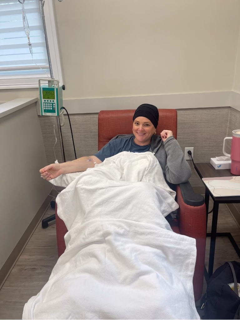 woman sitting in chair getting chemotherapy