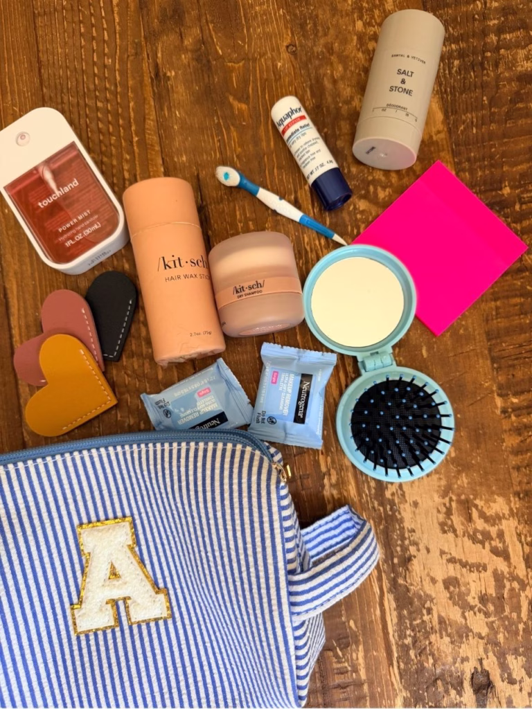 A blue and white striped bag with cosmetics