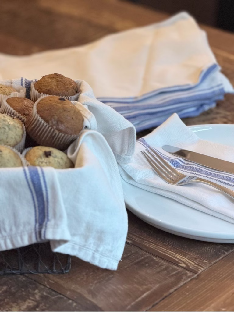 washable towels with a basket that has banana muffins in it