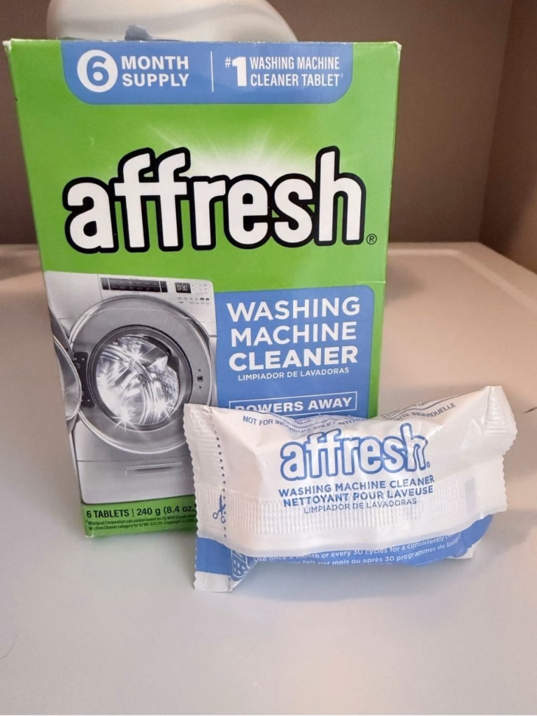 Affresh washing macine cleaner on top of a washing machine